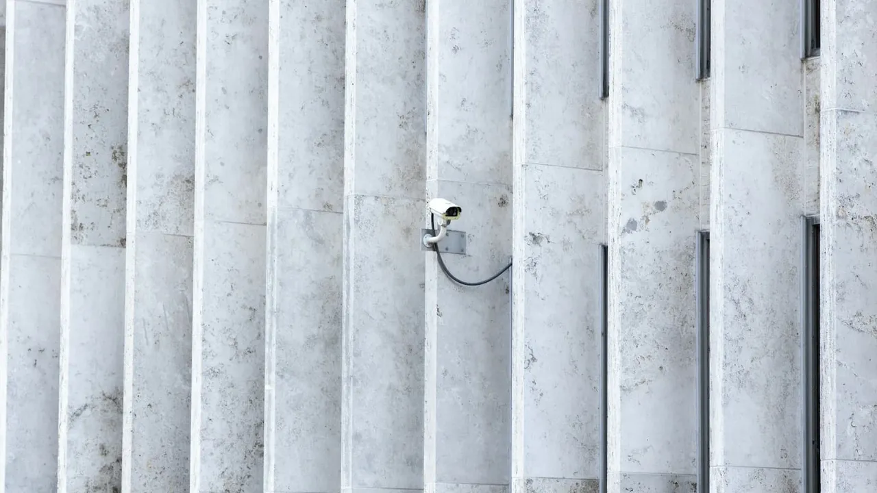 Concrete slab walls with an attached security camera.